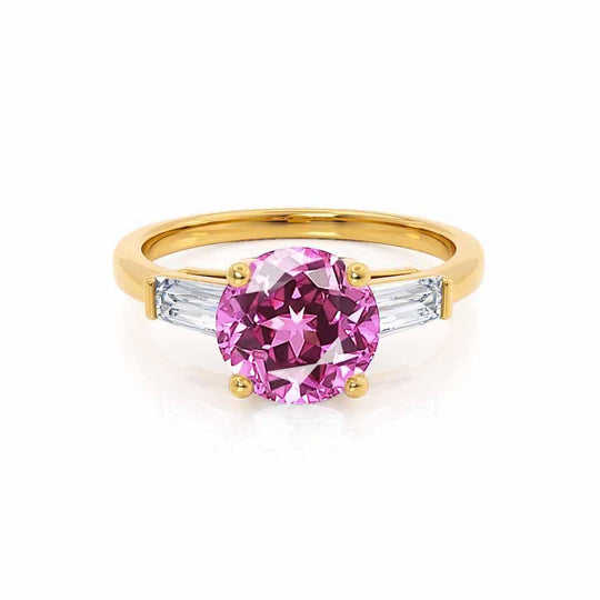 AZALEA – Round Lab-Grown Pink Sapphire & Baguette Diamond Trilogy Ring in 18k Yellow Gold